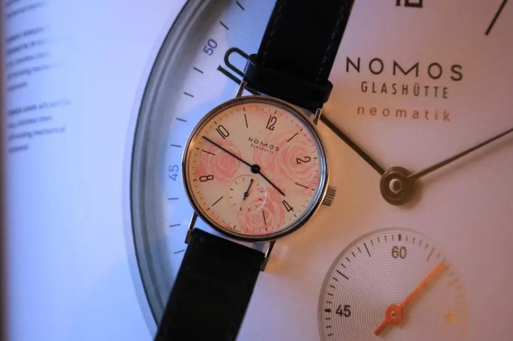 Nomos Tangente Rosemarie on a Nomos book